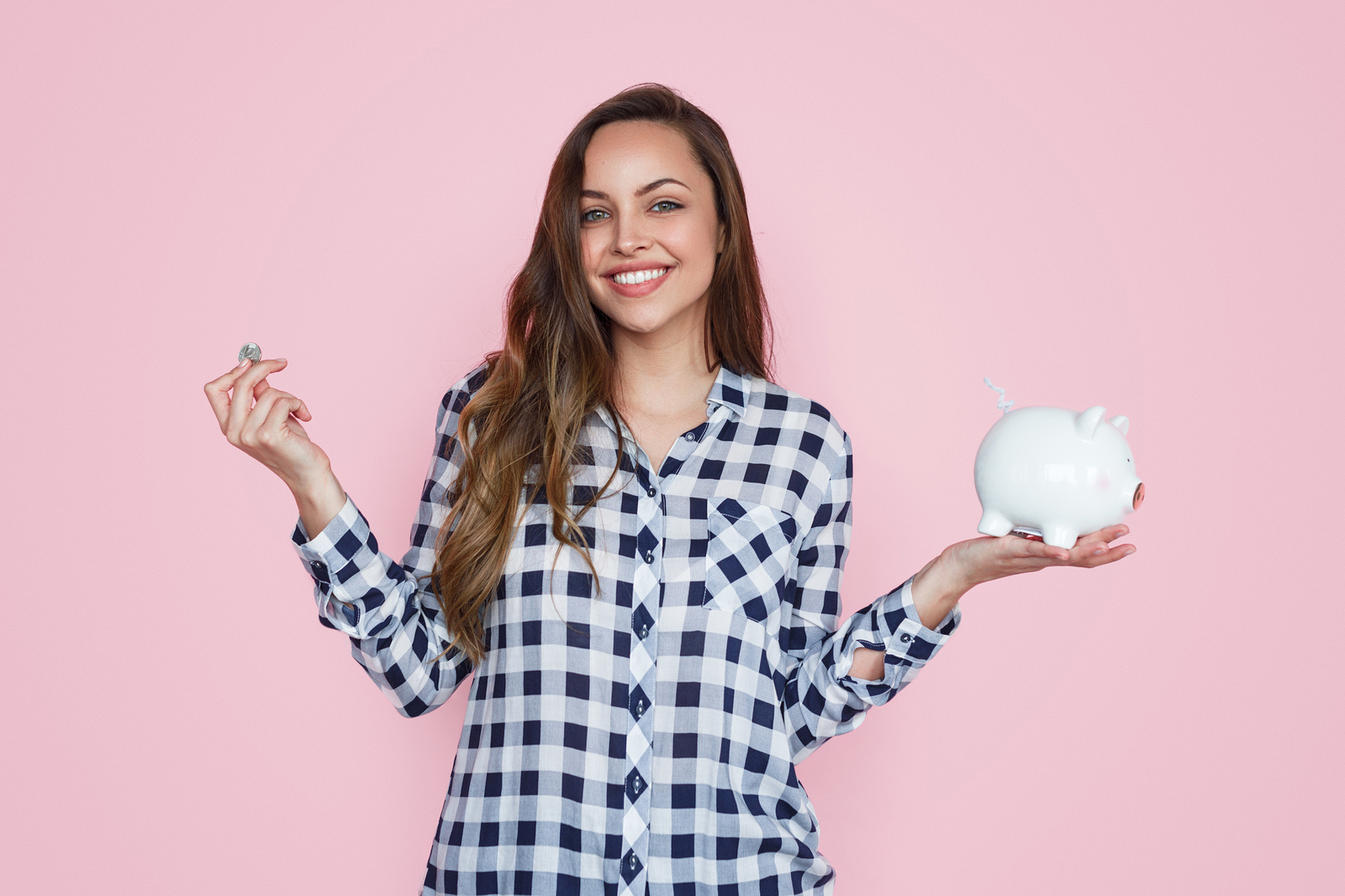 Pretty Young Woman Smiling And Looking At Camera While Standing